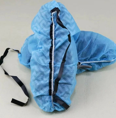 Couvertures de chaussures à semelles pointillées non tissées protection contre la poussière 100pcs par sac blanc
